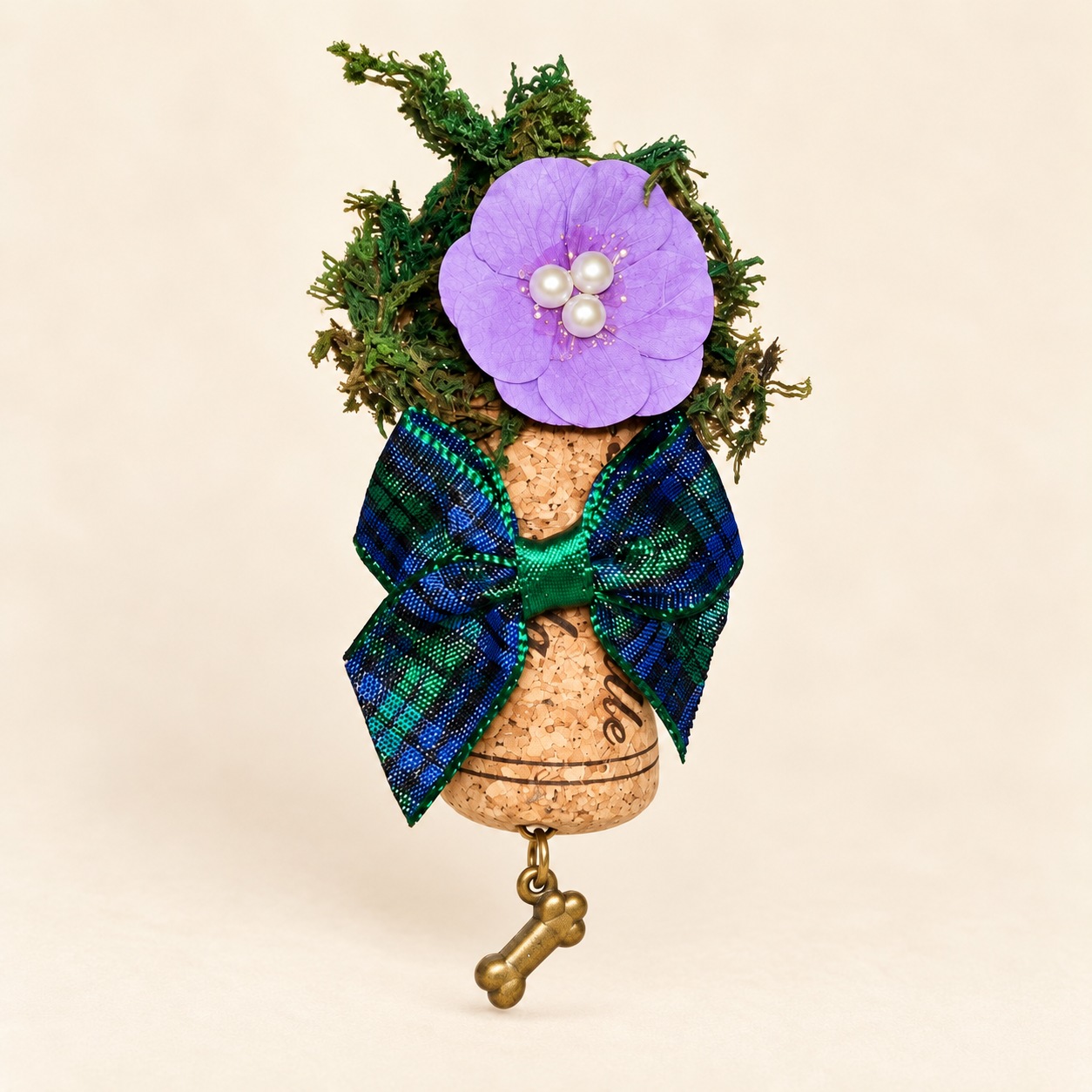 a purple flower cork magnet with tartan bow
