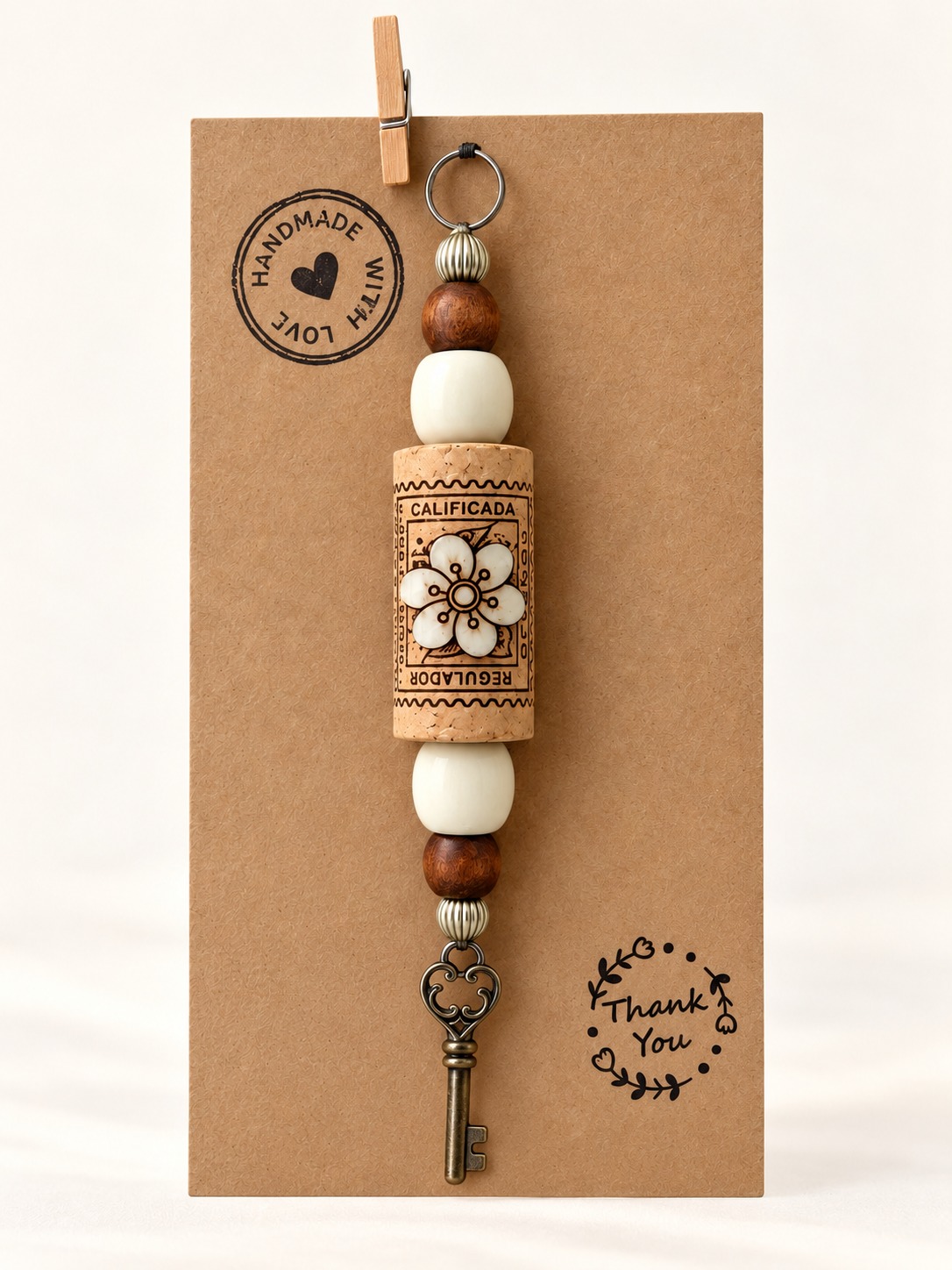 Packaged cork hanging decoration with a wooden flower and key charm